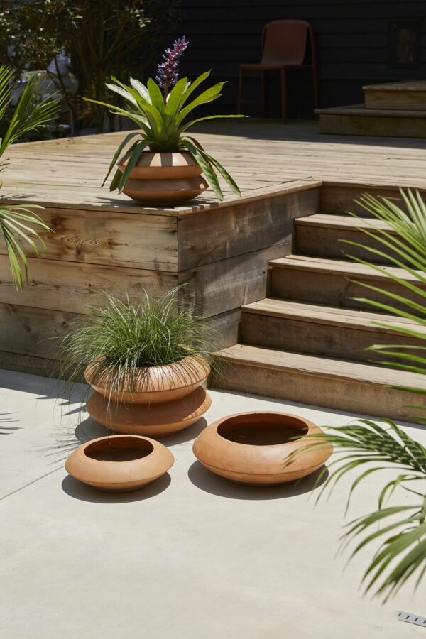 Avana Stacking Planters Collection set by some stairs